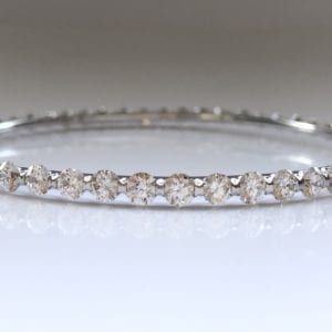 A Diamond Bangle, set with fifty two brilliant-cut diamonds