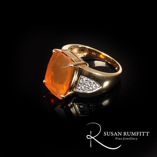 A Fire Opal and Diamond Ring in 18 carat Gold