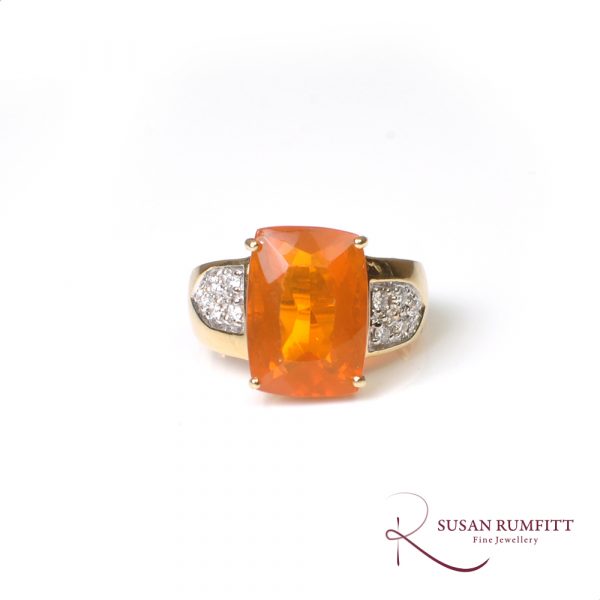A Fire Opal and Diamond Ring in 18 carat Gold