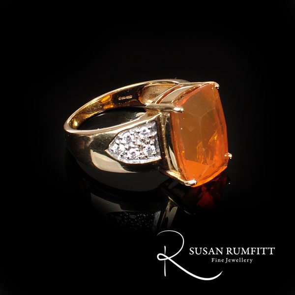 Opal October's birthstone - ire opal and diamond ring in 18 carat gold for sale at Susan Rumfitt's fine jewellery gallery in Harrogate