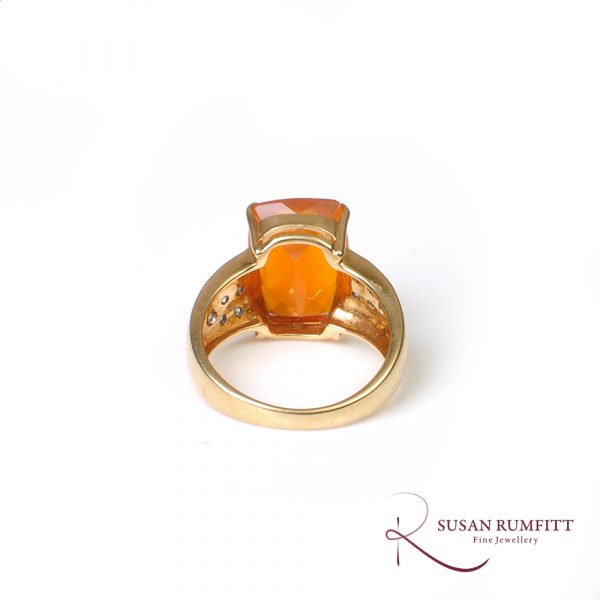 A Fire Opal and Diamond Ring in 18 carat Gold