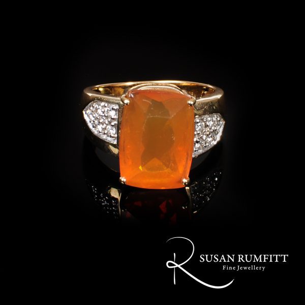A Fire Opal and Diamond Ring in 18 carat Gold