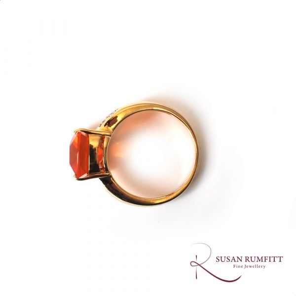 A Fire Opal and Diamond Ring in 18 carat Gold