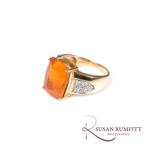 A Fire Opal and Diamond Ring in 18 carat Gold