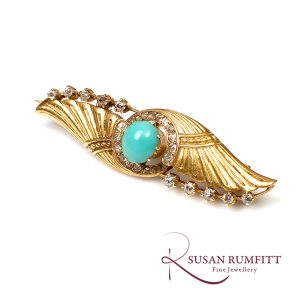 Art Deco Egyptian revival gold brooch with diamonds and turquoise.