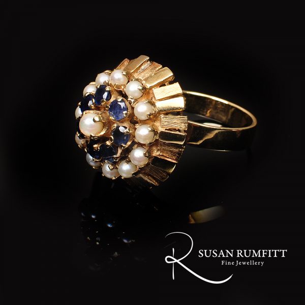 A Sapphire and Cultured Pearl Floral Bombe Cocktail Ring, circa 1960