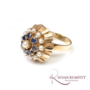 A Sapphire and Cultured Pearl Floral Bombe Cocktail Ring, circa 1960