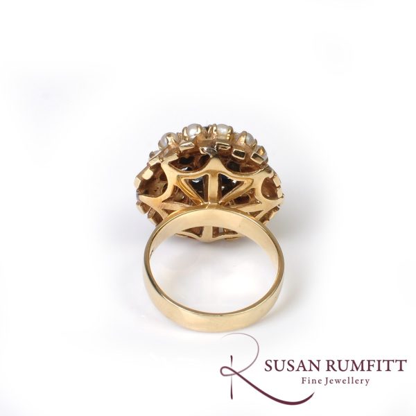 A Sapphire and Cultured Pearl Floral Bombe Cocktail Ring, circa 1960
