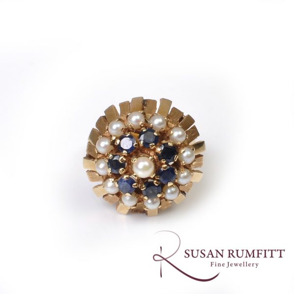 A Sapphire and Cultured Pearl Floral Bombe Cocktail Ring, circa 1960