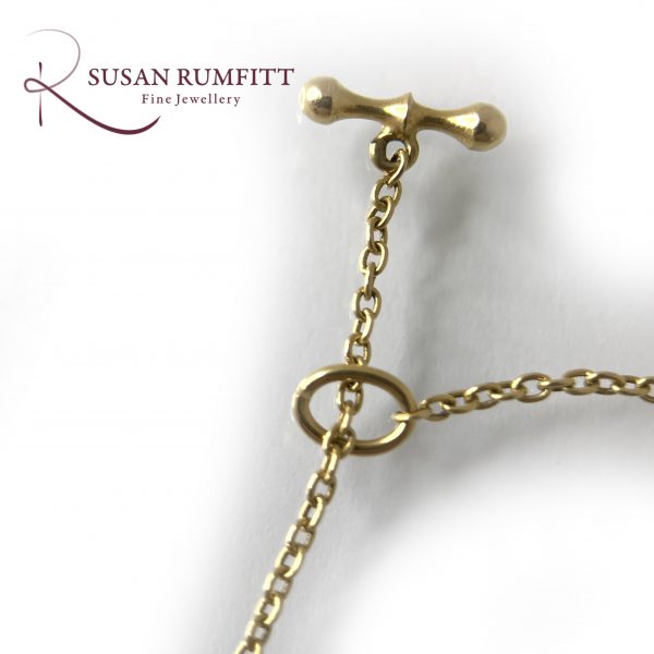 An Art Nouveau Amethyst, Peridot and Seed Pearl Suffragette Pendant