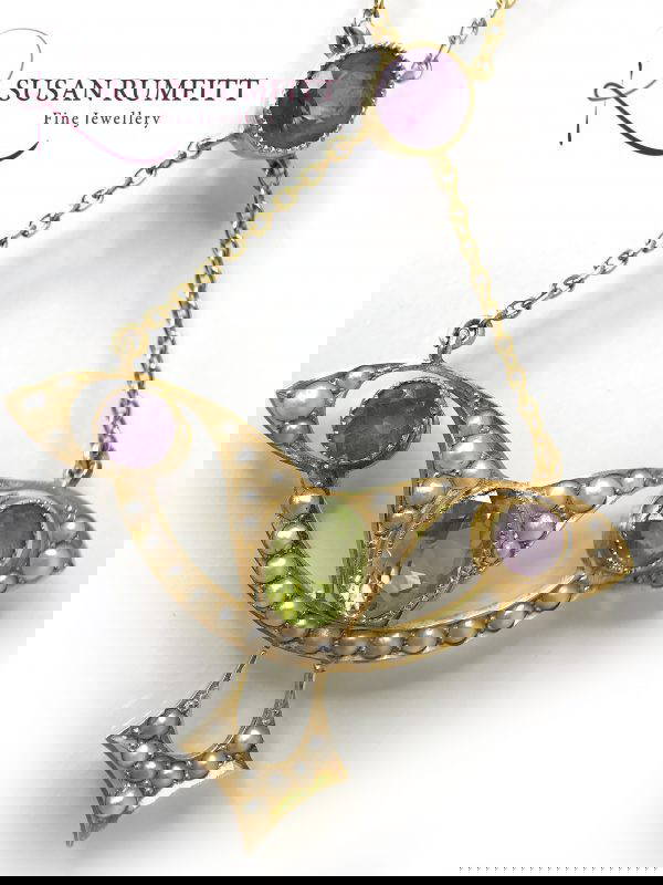 An Art Nouveau Amethyst, Peridot and Seed Pearl Suffragette Pendant