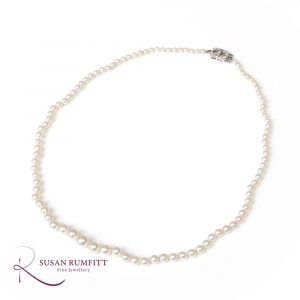 A Cultured Pearl Necklace with Art Deco Diamond clasp, circa 1920
