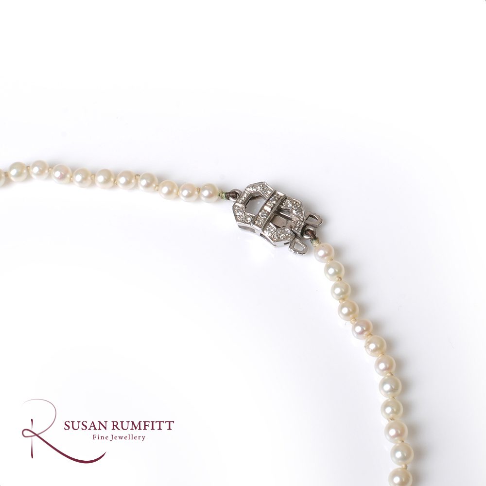 A Cultured Pearl Necklace with Art Deco Diamond clasp, circa 1920