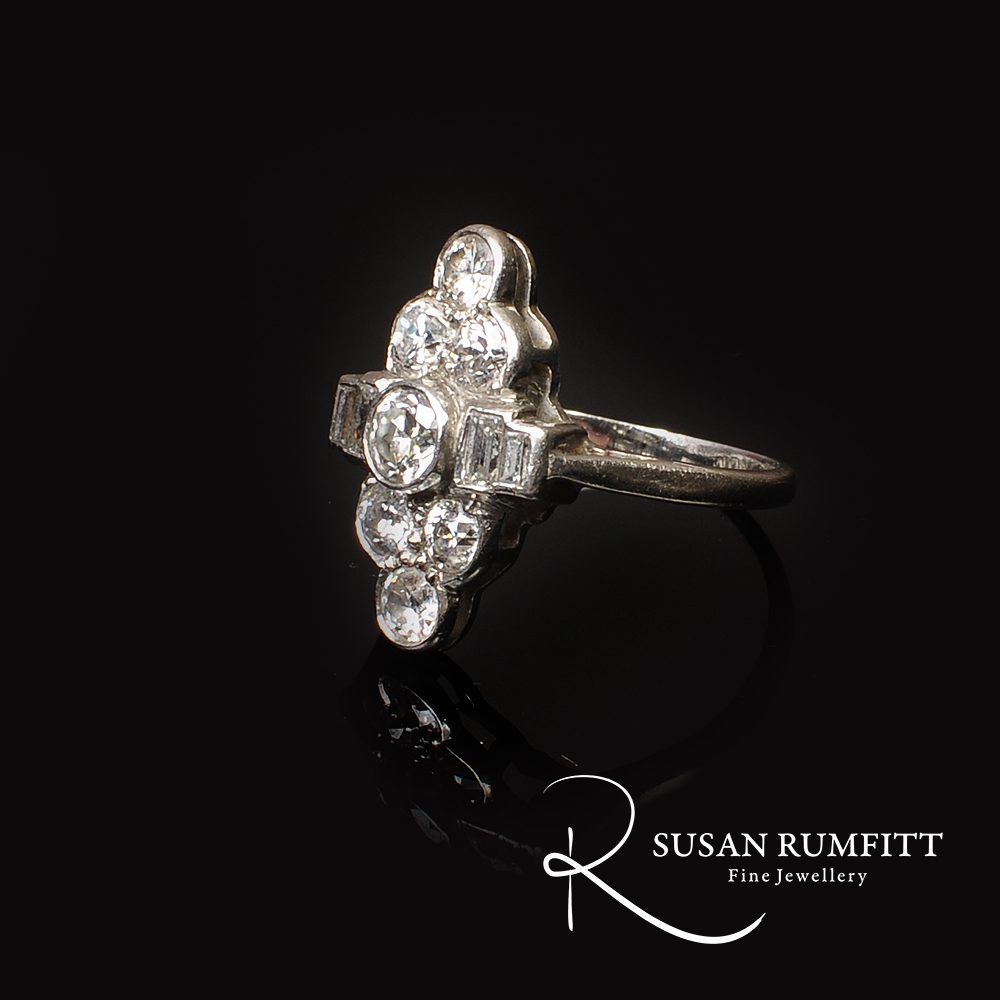 An Art Deco Diamond Dress Ring with Baguettes, Circa 1920