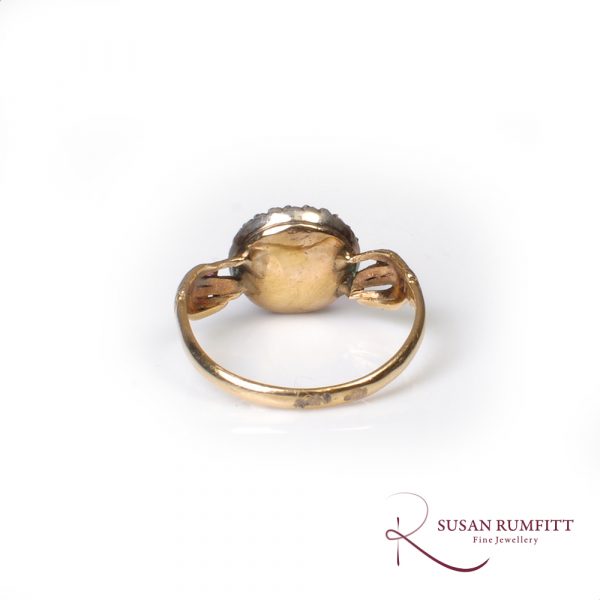 An antique amethyst sugar loaf and diamond fede ring