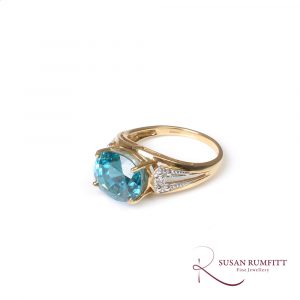 Blue zircon and diamond accent ring