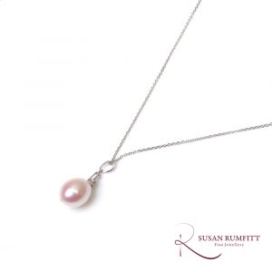 An Oval Cultured Pearl and Diamond Drop Pendant Necklace