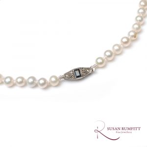 A Cultured Pearl Necklace with Sapphire and Diamond Clasp