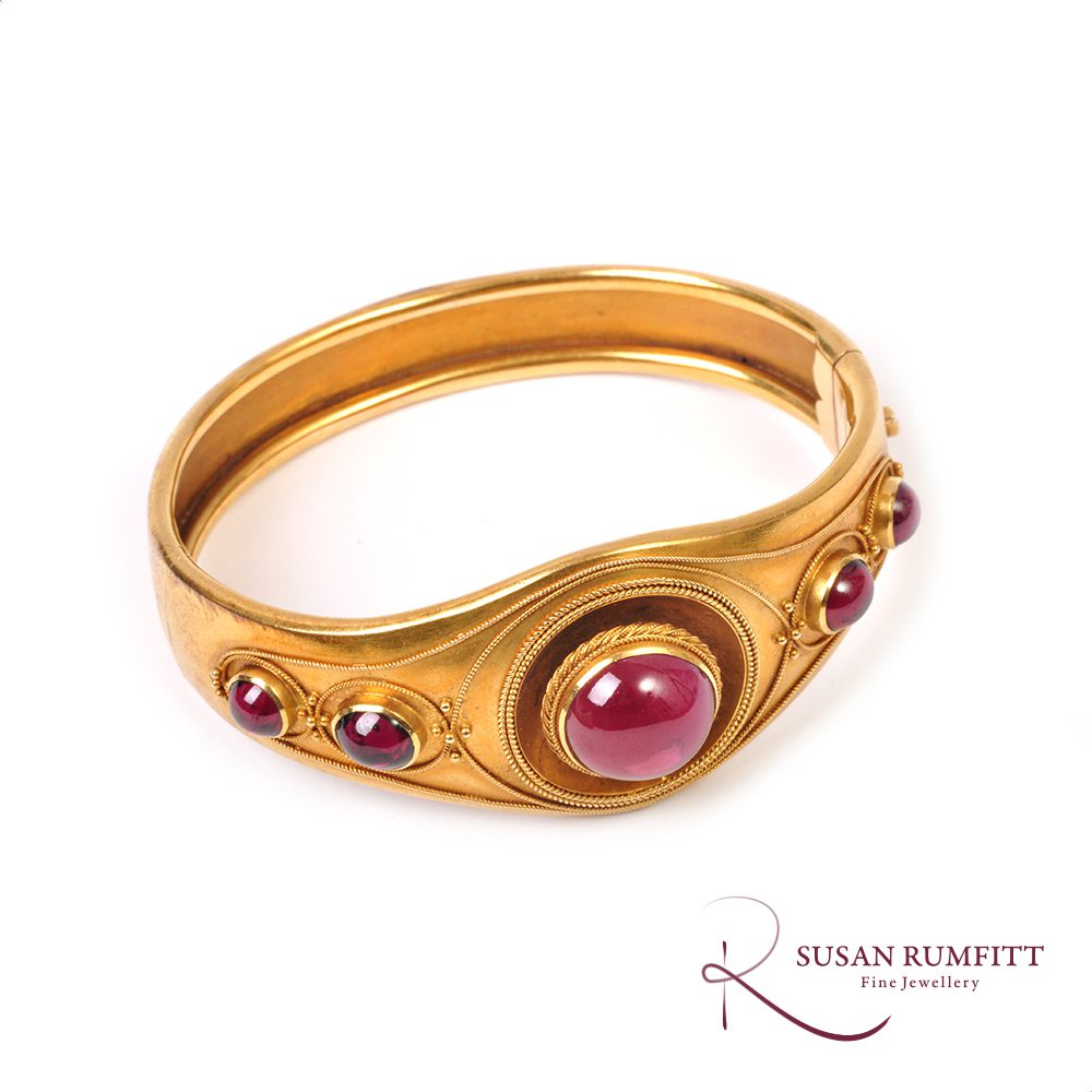 A Victorian Etruscan Revival Garnet Bangle Circa 1880