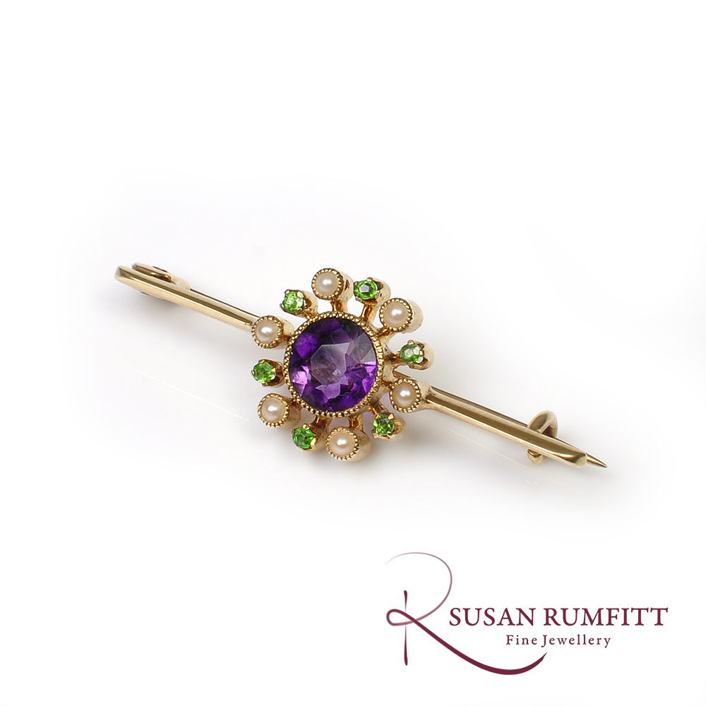 An Antique Suffragette Amethyst Seed Pearl and Peridot Brooch