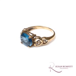 A Blue Topaz and Diamond Ring