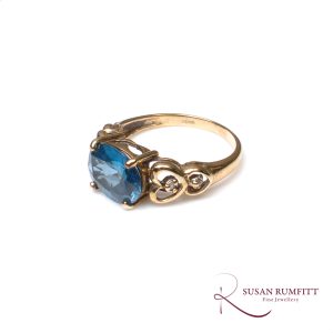 A Blue Topaz and Diamond Ring