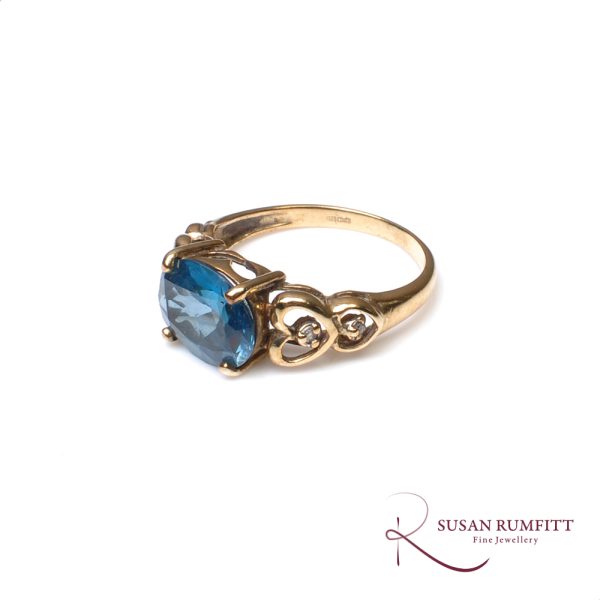 A Blue Topaz and Diamond Ring
