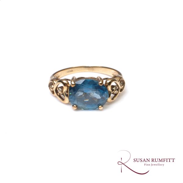 A Blue Topaz and Diamond Ring