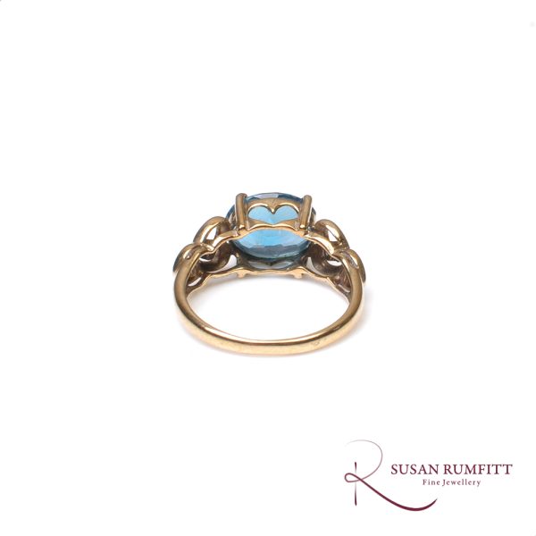 A Blue Topaz and Diamond Ring