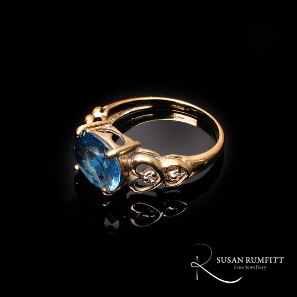 A Blue Topaz and Diamond Ring