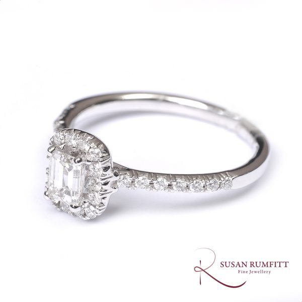 An Emerald Cut Diamond Cluster Ring