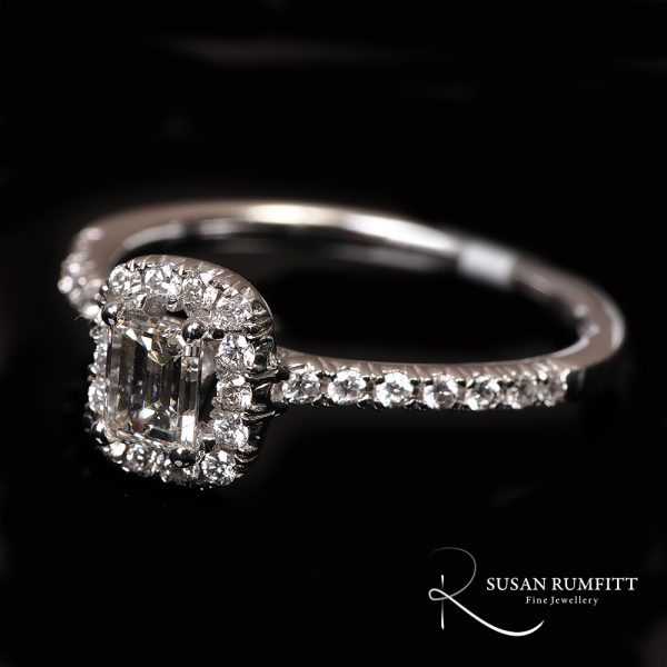 An Emerald Cut Diamond Cluster Ring