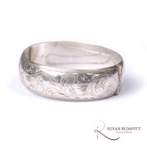 An Engraved Silver Hinged Bangle