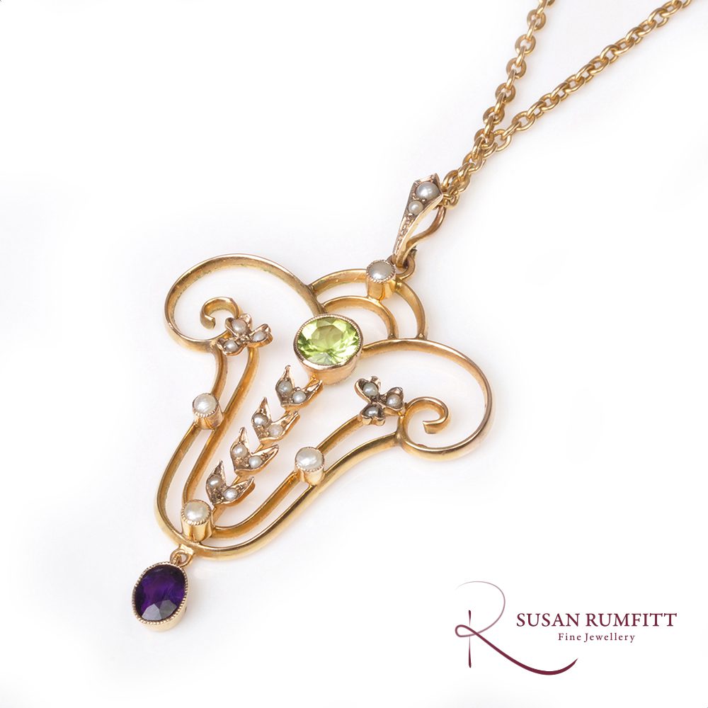 377M A Late Victorian Amethyst, Peridot, and Seed Pearl Pendant Necklace, Circa 1890